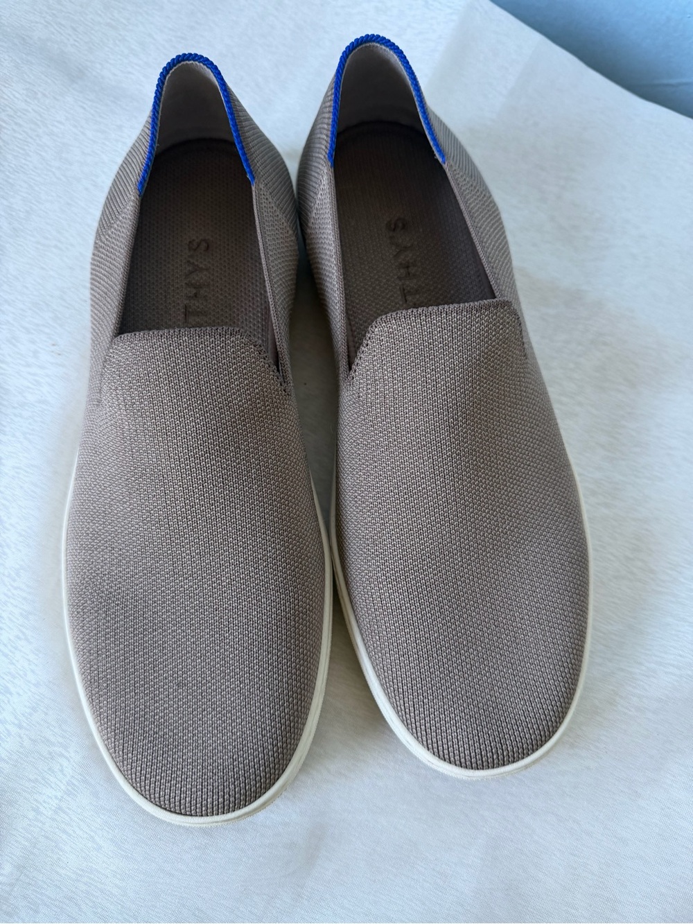 Rothy's Slip-On Knit Sneakers in Taupe with Blue Heel Trim